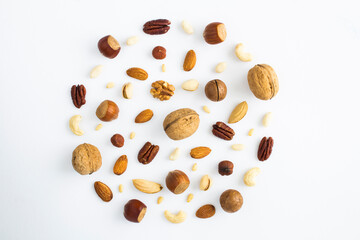 Dried nuts on the white background. Top view. Closeup.