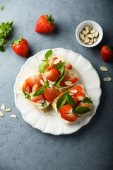 Strawberry crostini with basil and almond 