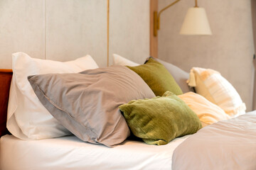 cosy bedroom interior close up soft bed arrange on white soft bed sheet in bedroom at home,interior...