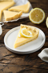 Traditional homemade lemon tart on a white plate