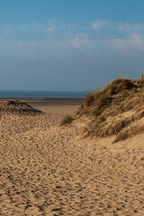 The coast at Formby in Merseyside, with a blue sky overhead