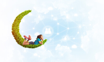Concept of careless happy childhood with girl dreaming about something