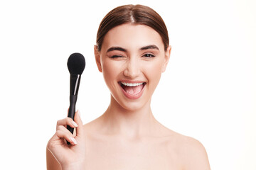 young beautiful woman with make-up brush for powder