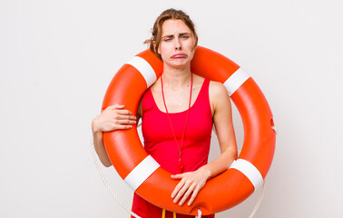 young pretty woman  feeling sad and whiney with an unhappy look and crying. lifeguard concept