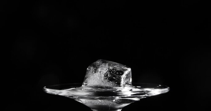 Time lapse of melting ice cube. Video shot close up.
