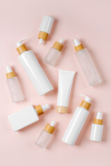 Cosmetic container mockups for branding and packaging presentation. Pump bottle, cream tube, and dropper on pastel background. Natural skincare beauty product concept.