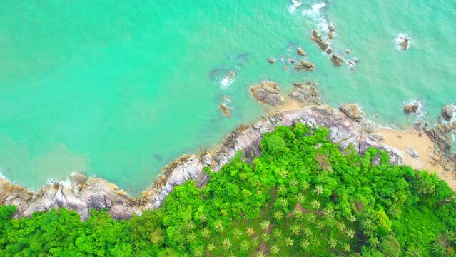 Aerial Top views over beaches, ocean waves crashing on rocks and sand. beautiful tropical sea. Khanom Sichon beaches. Nakhon Si Thammarat, Thailand. 4K drones
