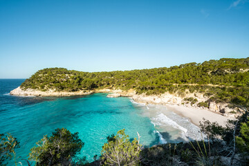 View of Mitjaneta beach with beautiful turquoise seawater, Menorca island, Spain

