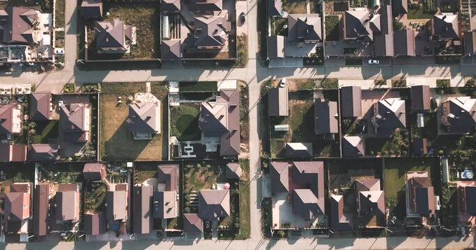 Aerial view of a luxurious village with smooth rows of two-storey duplex houses. Neighborhood in the area and real estate investments.