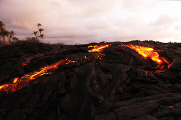 Hazy sunrise over active lava field, flowing magma, Kilauea, Big Island, Hawaii