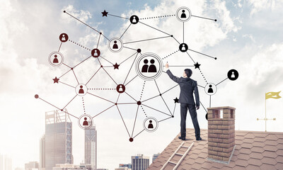 Businessman on house roof presenting networking and connection c