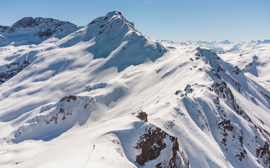 Fototapeta na wymiar Hiking in Swiss Alps in winter