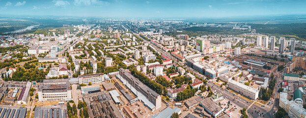 Aerial view of urban skyline of a modern city with site development and busy crossroads and streets