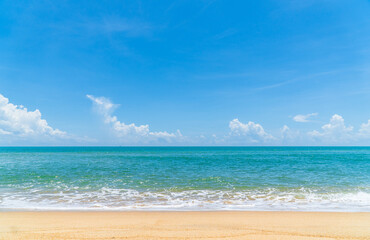 Sand beach seaside with with foamy wave from blue sea and blue sky clouds on daylight, landscape summer season travel 