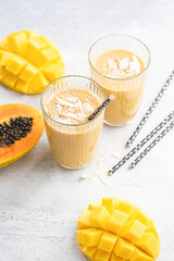 Mango coconut yogurt smoothie in glass