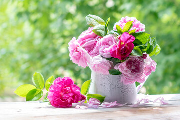Bouquet of pink tea roses on a sunny spring day.Bulgarian Damascena Rose.Space for text.Toned