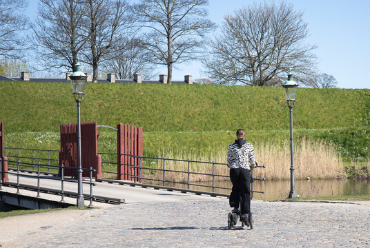 Young woman riding segway in the park in Copenhagen, Denmark. High quality photo