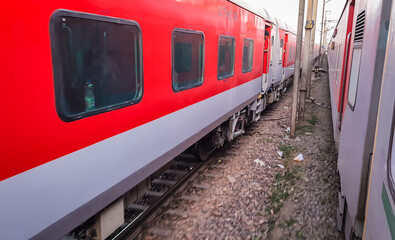 Fototapeta premium train running on railway track with flat sky at morning from different angle