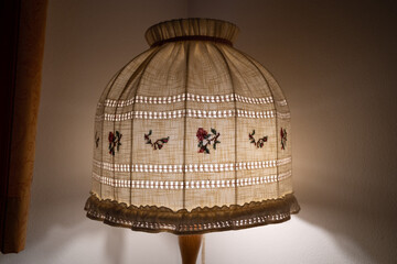 Old luminous floor lamp with country style lampshade