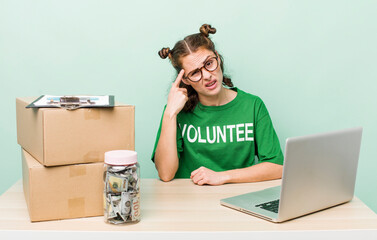 young pretty woman  feeling confused and puzzled, showing you are insane. donation volunteer concept