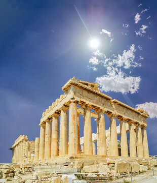 parthenon athens greece in sping season with redbud 's flowers and blue sky