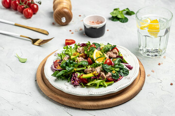 Tuna salad with lettuce, cherry tomatoes, avocado and red onions. Delicious breakfast or snack, Clean eating, dieting, vegan food concept. top view