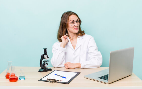 young pretty woman  looking arrogant, successful, positive and proud. scientist with microscope concept