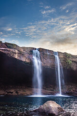 Obraz premium waterfall streams falling from mountain top at morning long exposure shot from different angle
