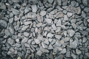 Dark gray stones gravel background.