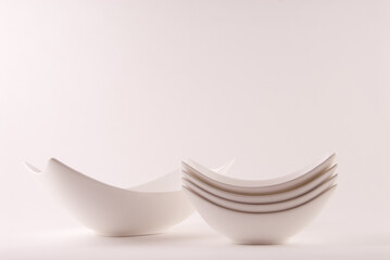 Stack of ceramic bowls on white