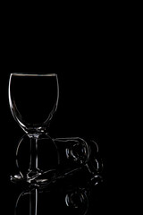 wine glass photographyand  product photography using light effects and low light on a black background
