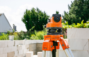 Surveyor equipment tacheometer or theodolite outdoors at construction site. Copy space. Close-up....