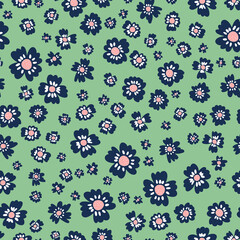 Cute floral seamless repeat pattern. Random placed, irregular vector flower heads all over surface print on green background.