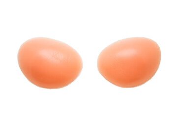 Silicone breast inserts on a white background