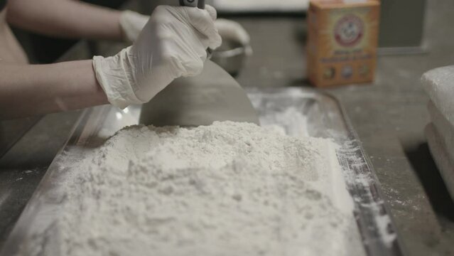 Close up shot of powder cocaine being cut up with baking soda