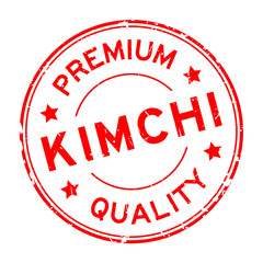 Grunge red premium quality kimchi word round rubber seal stamp on white background