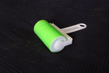 washable sticky lint roller with cat hair on it. no waste sticky roller