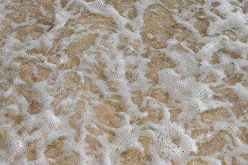 Fototapeta na wymiar Sandy Sea Floor under the Wave - An Overhead view
