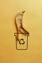 A man throws food waste into a dumpster .Sorting and recycling of garbage