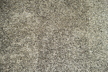 Textured background of gray stone chips. Copy space.