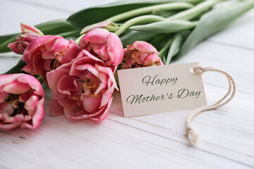 Bouquet of pink tulips and tag mockup for text on white background