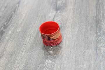 slinky on the wooden floor. Top view, flat lay composition