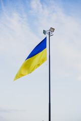 Flag of Ukraine on the sky background . Vertical image