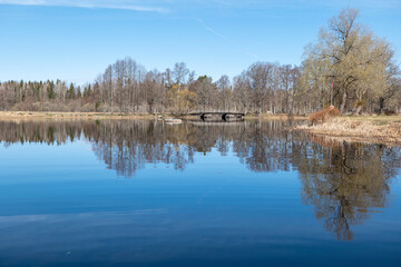 Calm lake reflection in springin a sunny day.