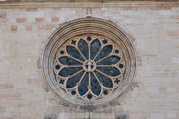 Fototapeta na wymiar The round window of Trento Cathedral in Trento, Italy. Close-up
