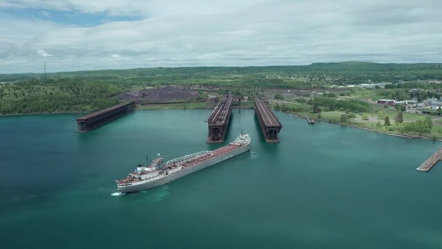 Aerial, michipicoten lake freighter cargo vessel ship docking at Agate Bay Two Harbors in Minnesota