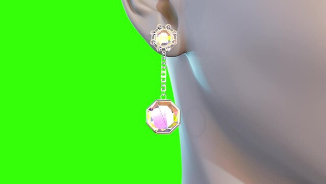 golden eardrop with diamond on chroma key screen, isolated, fictive