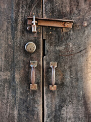 Closeup old rusty lock on the door and broken wood of lock. wood background.