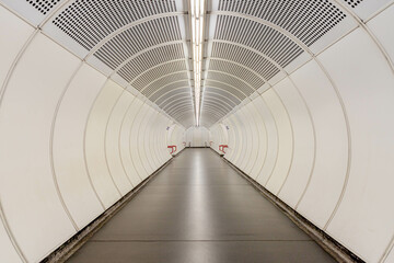 Tunnel of public transportation in city center, Interior of walkway in subway, Empty underground metro station, Vienna public transport, Capital of Austria.