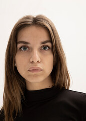 portrait of a pensive woman on a light background